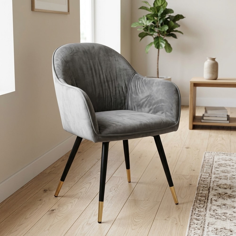 Sillón de terciopelo gris con patas negras y oro