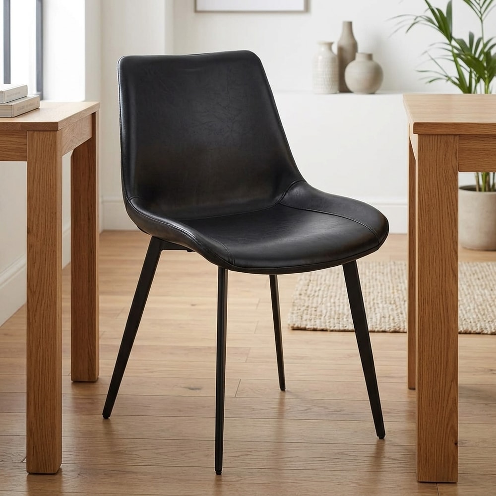Silla de comedor tapizada en similpiel negra
